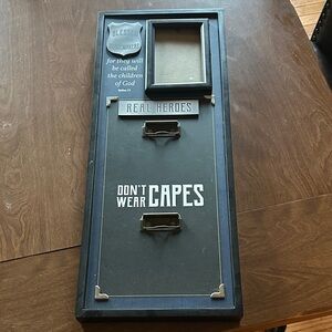 Open Road Brands Blue and Black 'Real Heroes Don't Wear Capes' Wall Sign